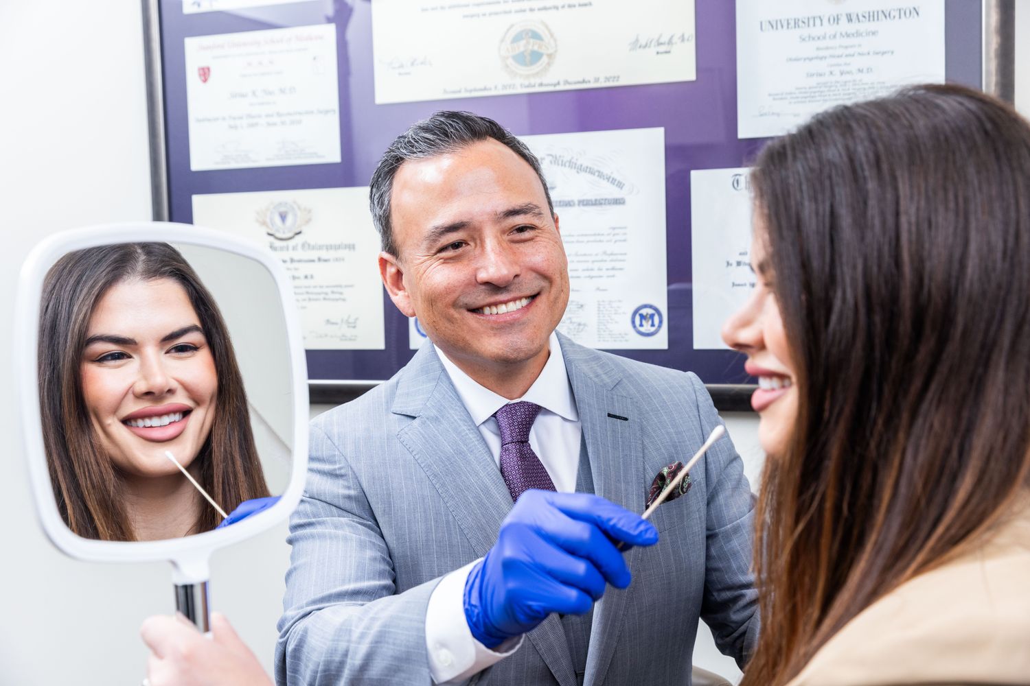 Dentist consulting with patient in an office.