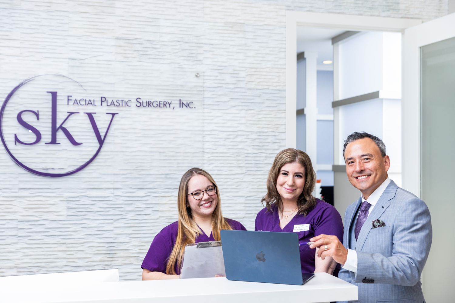 Dentist examining patient with mirror and tool.