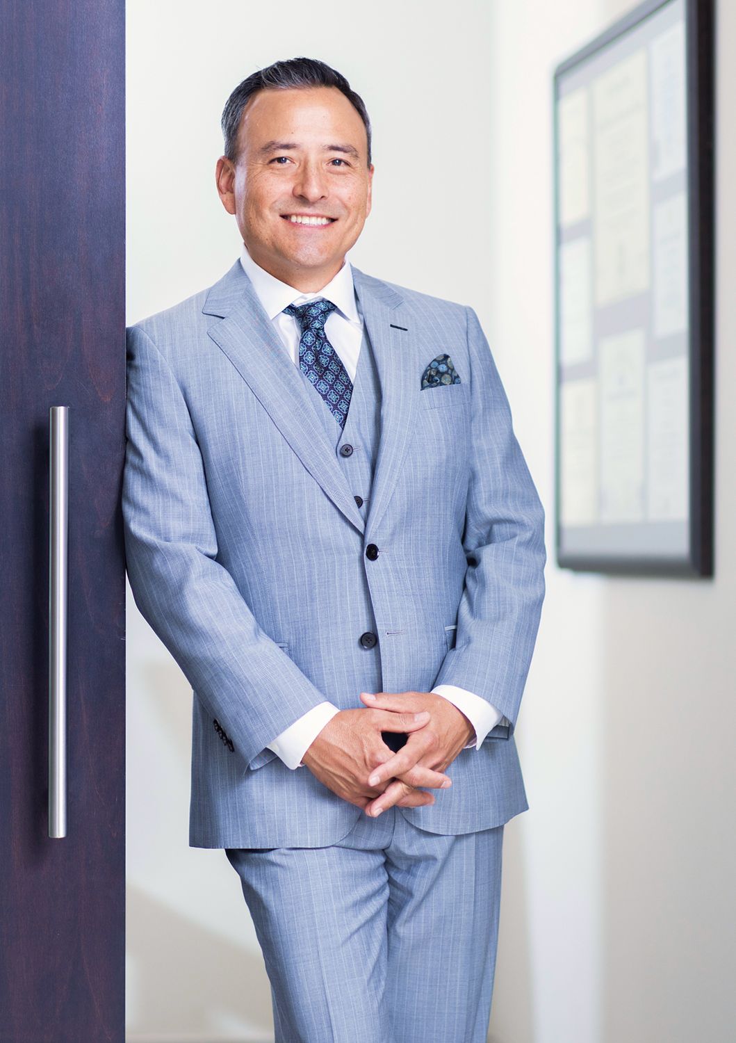 Smiling professional man in a business suit.