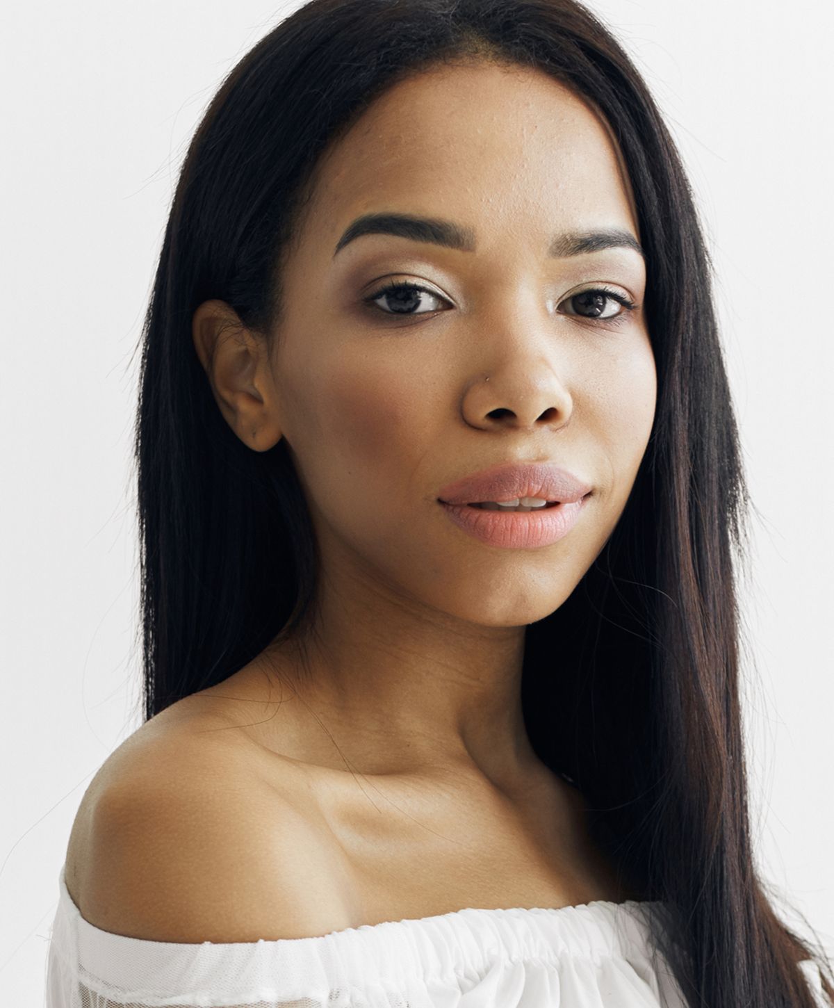 Woman with long hair and natural makeup.