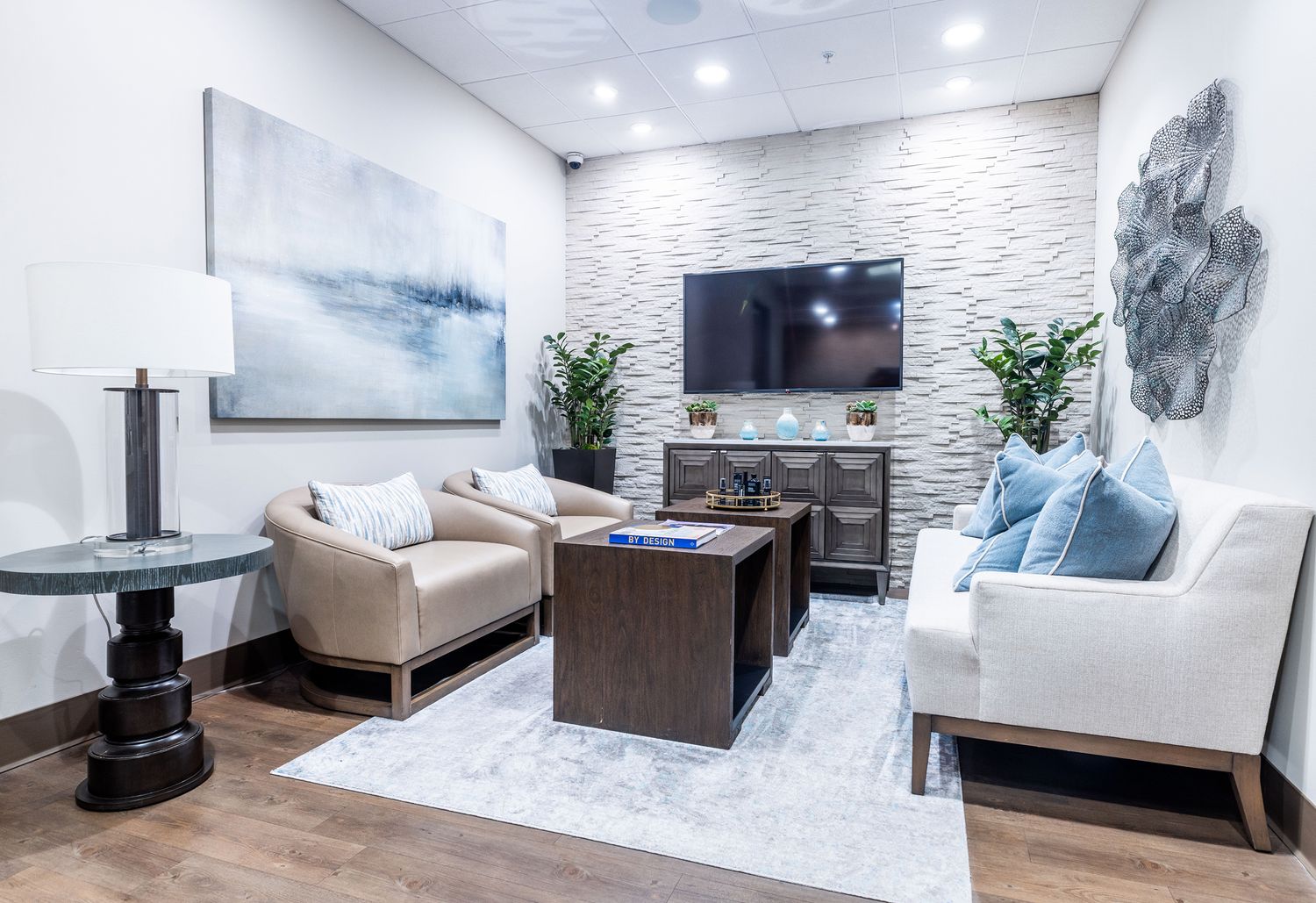 Modern lounge area with stylish furniture and decor.