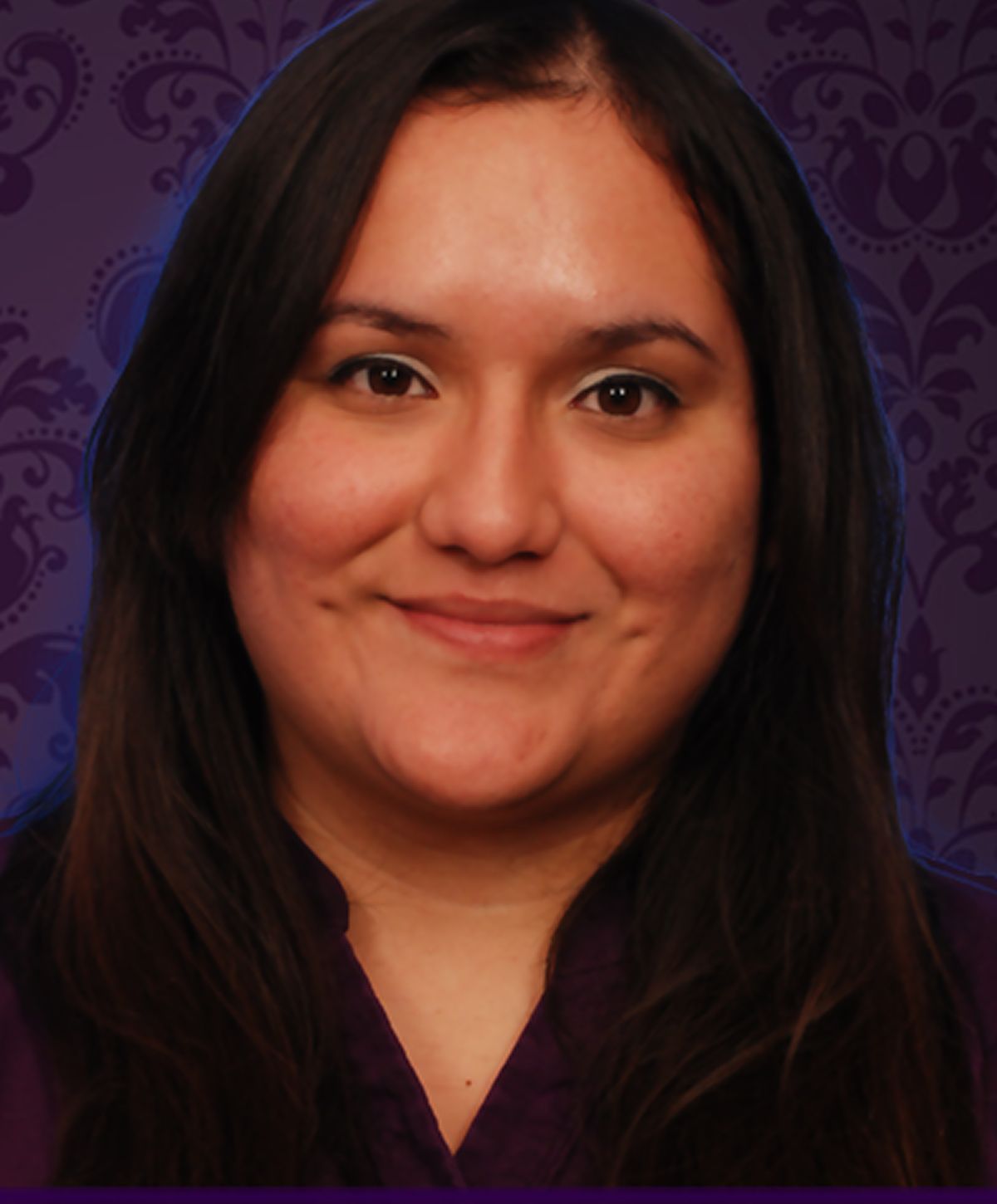 Smiling woman with dark hair and purple background.