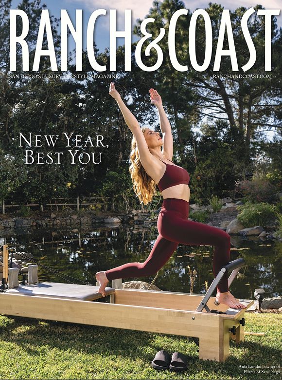 Woman exercising on a reformer by a pond.