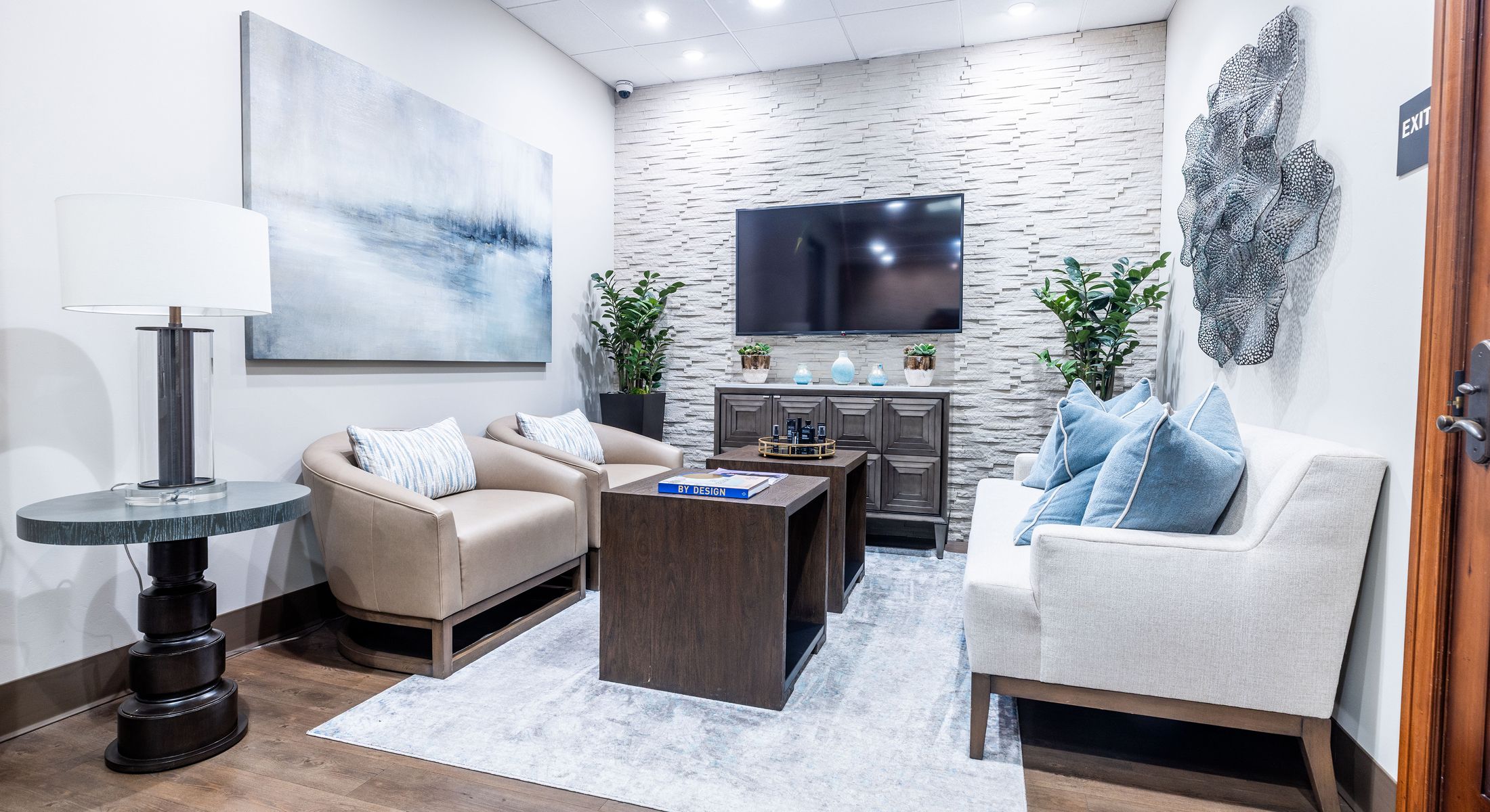 Modern waiting room with stylish furniture and decor.